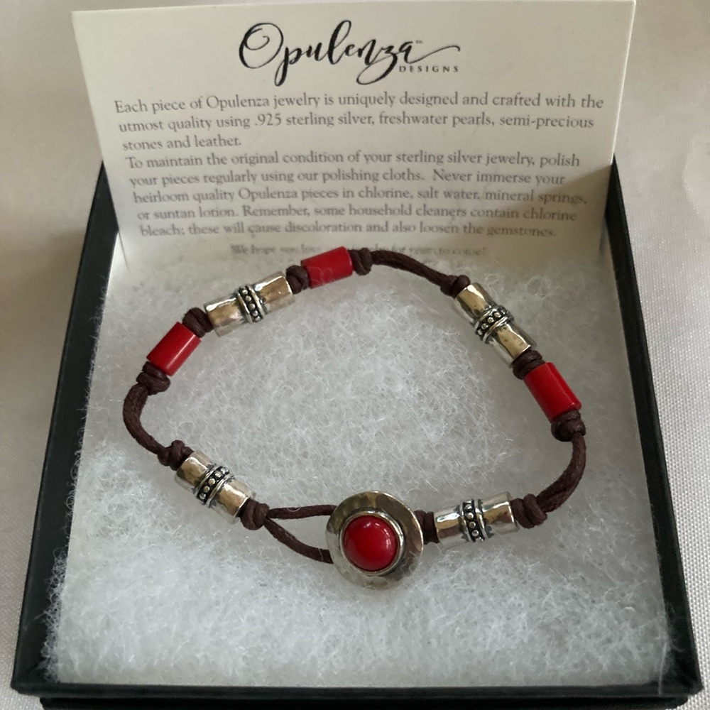 Opulenza Designs Red Coral & Sterling Silver on Brown Cord.